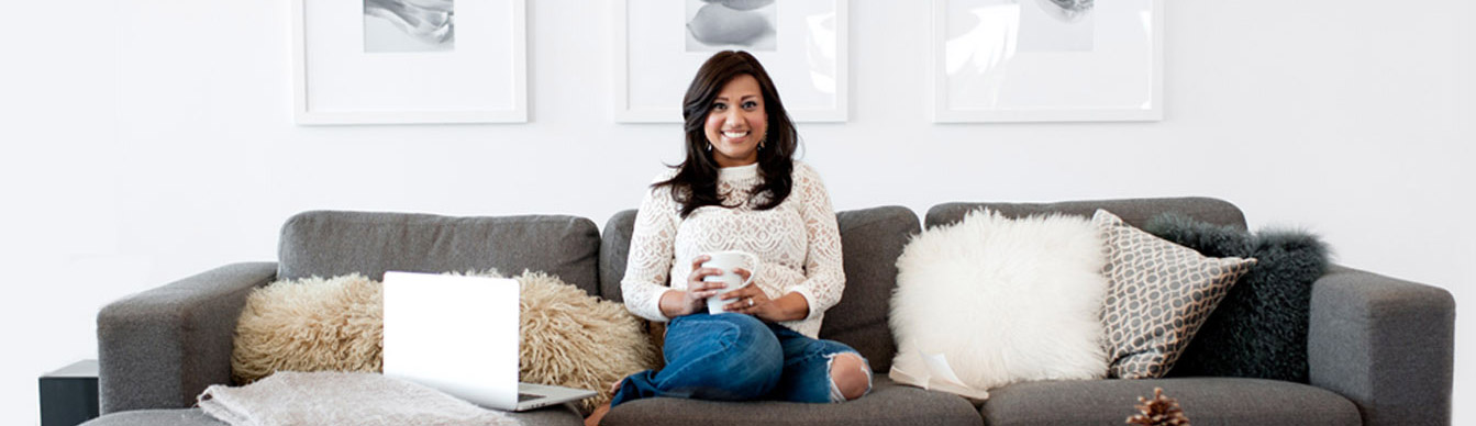Kavita sitting on a couch